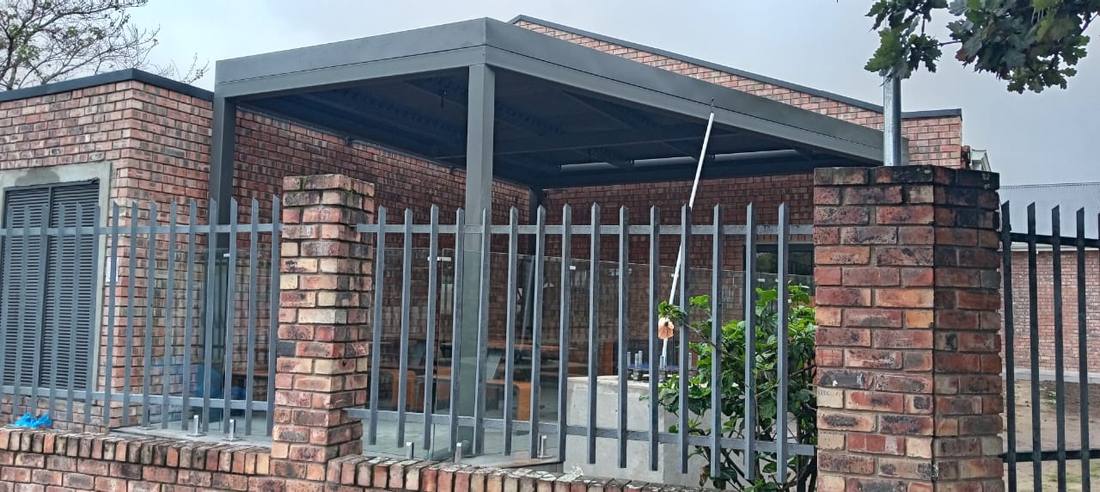 Louvre canopy spanning the face-brick terrace at McDonald's Grahamstown