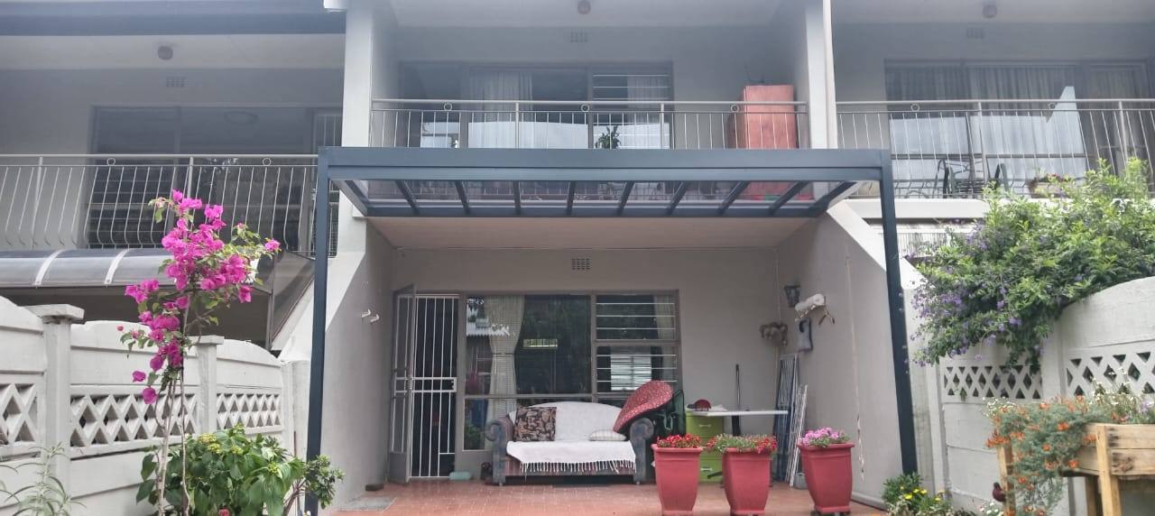 Polycarbonate Roof under a Balcony — Fairlands
