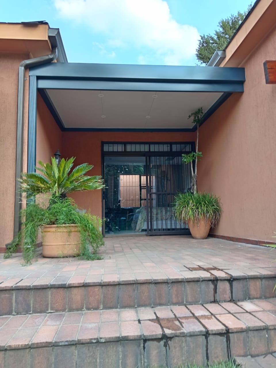 Insulated Ceiling and Stack Folding Doors — Kew