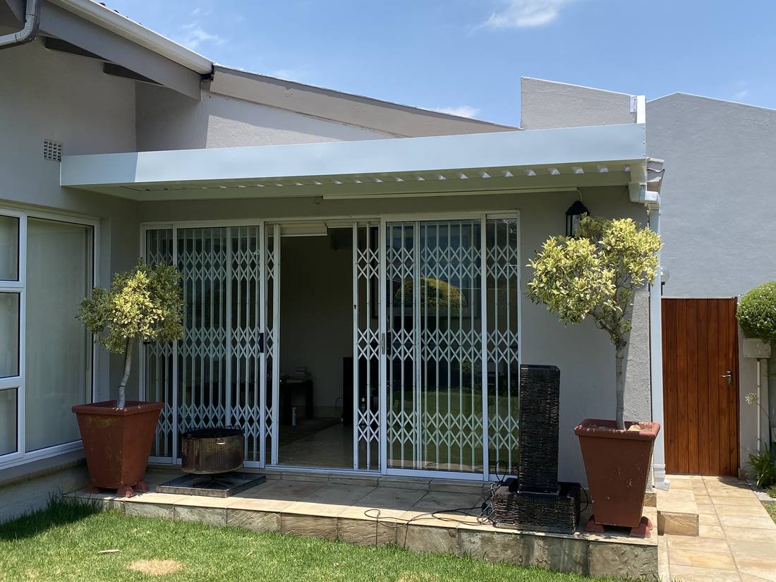 The white IBR awning and boxed fascia seen from the garden
