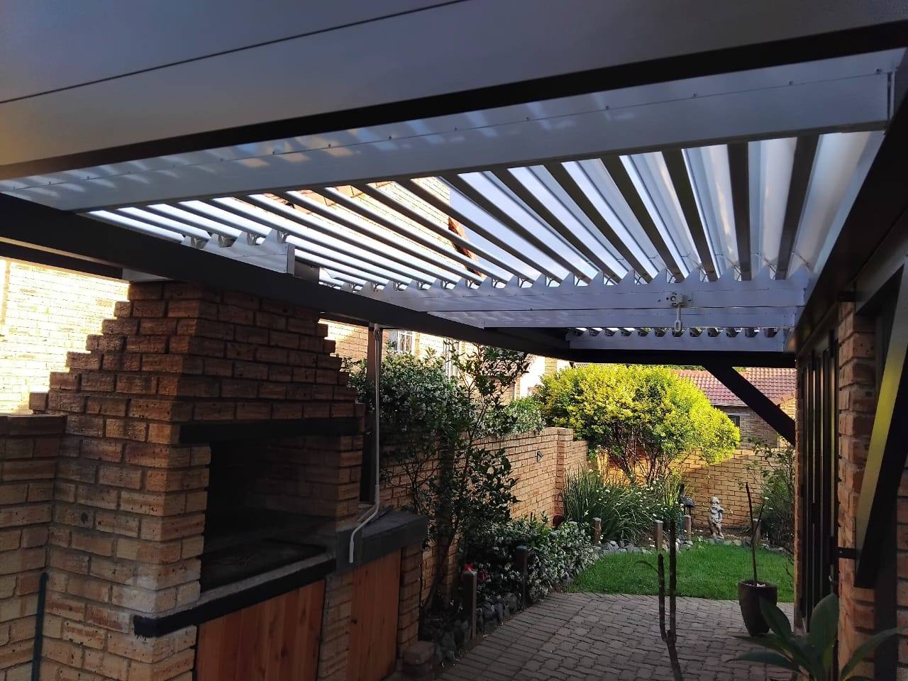 Bronze Louvre over a Built-In Braai — Wilgeheuwel