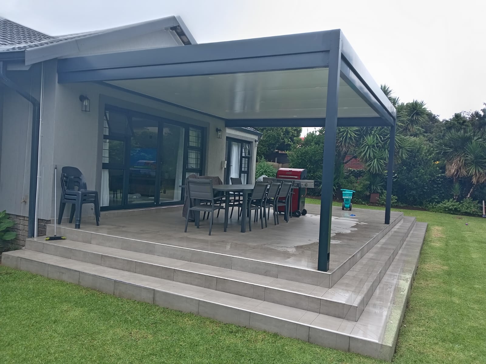 Home with a charcoal louvre awning over the patio, Benoni